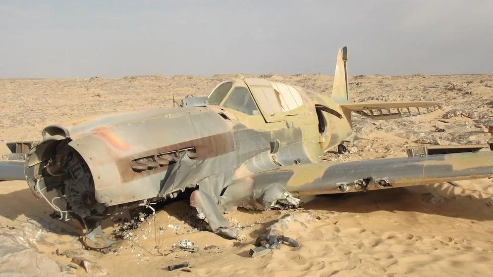 70-Year-Old WWII Kittyhawk Plane Gets Jaw-Dropping Shark's Teeth Makeover in Sahara Crash Site - You Won't Believe the Incredible Transformation